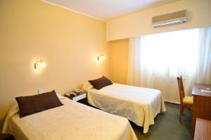 Postel nebo postele na pokoji v ubytování Conquistador Hotel + 43 fotografií