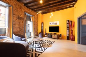 Telewizja i/lub zestaw kina domowego w obiekcie Home2Book Stylish Design House in La Laguna Center