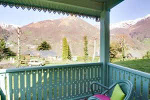 a porch with a view of the mountains at Chalet de Peyrelance in Cauterets