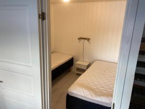 Tempat tidur dalam kamar di Mökki Mäntyniemi Taivalkoski