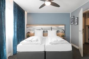 Ένα ή περισσότερα κρεβάτια σε δωμάτιο στο Riverview Apartments by dasPaul
