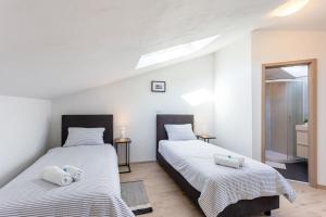 Postel nebo postele na pokoji v ubytování Apartments Punta Premantura