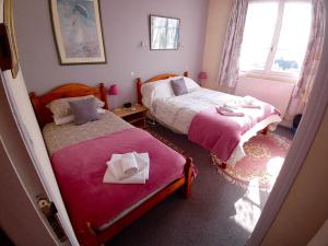 Postel nebo postele na pokoji v ubytování Lenard Charles Bed & Breakfast