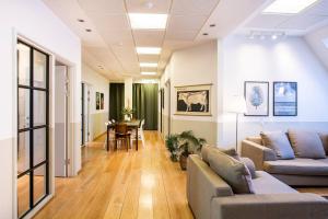 a living room with two couches and a table at Kings Garden Penthouse - 4BR & 2Bath - by Daniel&Jacob's in Copenhagen