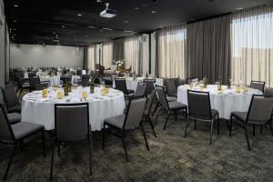 a dining room filled with tables and chairs at Rydges Fortitude Valley in Brisbane