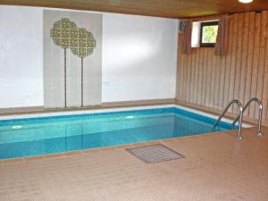 a swimming pool in a house with a pool at Ferienwohnung Samerhof Langenscheidt in Aschau im Chiemgau