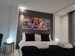 a bedroom with a bed and a television at Urban Spaces Ibiza in Ibiza Town