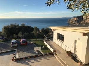 a house with a view of the ocean at Belvedere20guesthouse in Finale Ligure