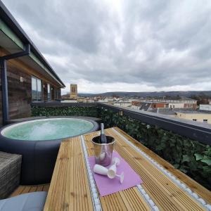 a hot tub on the roof of a building at Central Penthouse with Hot Tub & Views 24 Cheltenham in Cheltenham