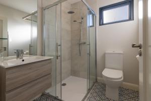 a bathroom with a shower and a toilet and a sink at Boyne View House in Trim