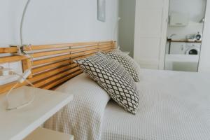 a bedroom with a bed with a pillow on it at Apartamentos ZHR 2 in Zahara de los Atunes
