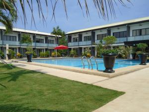 a swimming pool in front of a building at Bohol Jewel Resort in Dauis