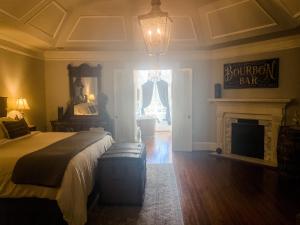 a bedroom with a bed and a fireplace at The Twelve Oaks Bed & Breakfast in Covington