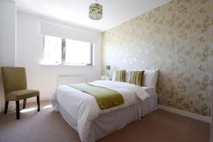מיטה או מיטות בחדר ב-Edinburgh Waterfront Apartments