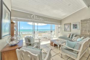 a living room with a view of the ocean at Colours of the Sea - Main house in Struisbaai