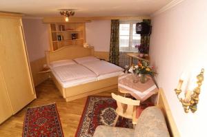Voodi või voodid majutusasutuse Hotel Gasthof Brüggler toas