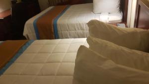 Postel nebo postele na pokoji v ubytování BA Hotel