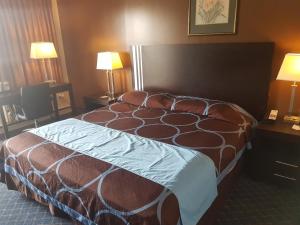 Postel nebo postele na pokoji v ubytování BA Hotel