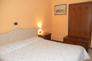 Postel nebo postele na pokoji v ubytování Hotel Salus