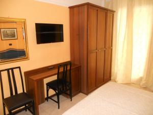 Postel nebo postele na pokoji v ubytování Hotel Salus