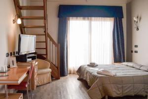 Postel nebo postele na pokoji v ubytování Planet Hotel