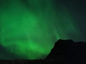an image of a green sky with the northern lights at Starlight Camping Pods in Hvolsvöllur