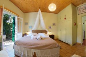 Postel nebo postele na pokoji v ubytování Villa Pergantini