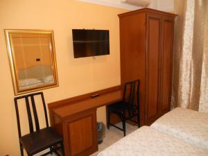 Postel nebo postele na pokoji v ubytování Hotel Salus