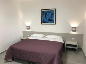 Postel nebo postele na pokoji v ubytování Residence Candeloro + 13 fotografií