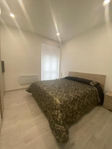 A bed or beds in a room at Torino Reale