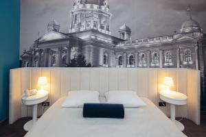 Voodi või voodid majutusasutuse Hotel Passport toas