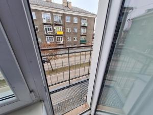 a view of a balcony from a window at Central station in Daugavpils