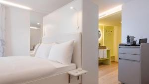 Postel nebo postele na pokoji v ubytování Neuro Campus Hotel + 37 fotografií