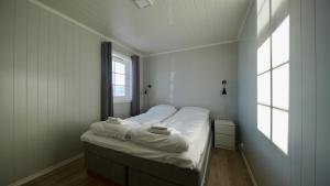 Ein Bett oder Betten in einem Zimmer der Unterkunft Lofoten Basecamp