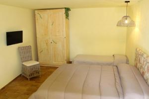 Een bed of bedden in een kamer bij Casale Il Ventaglio