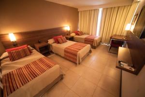 Postel nebo postele na pokoji v ubytování Hotel Estilo MB - Villa Carlos Paz