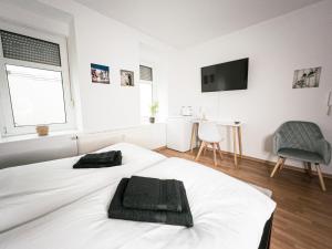Postel nebo postele na pokoji v ubytování Stilvolles 1-Zimmer-Apartment im beliebten Plagwitz
