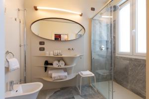 
a bathroom with a toilet, sink and tub at Hotel Ariston in Milan
