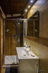 a bathroom with a sink and a shower at Perla del Marinaio in Riomaggiore +36 photos