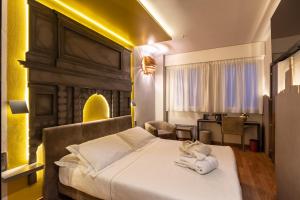 Postel nebo postele na pokoji v ubytování Hotel Ariston