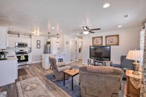 a living room with a couch and a tv at Central Kanab Apartment with Updated Interior! in Kanab