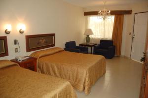 Cama ou camas em um quarto em Real de Minas San Luis Potosi