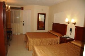 Cama ou camas em um quarto em Real de Minas San Luis Potosi