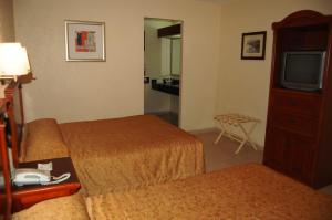 Cama ou camas em um quarto em Real de Minas San Luis Potosi