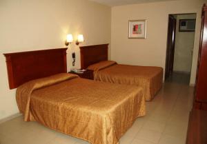Cama ou camas em um quarto em Real de Minas San Luis Potosi