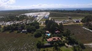 an aerial view of a resort with the ocean in the background at Mangaba Village in Barra Grande