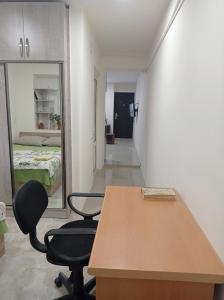 a room with a table and two chairs and a bed at Julia's Place - Apartment, Garden & BBQ in Vagharshapat