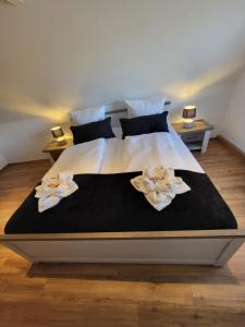 Postel nebo postele na pokoji v ubytování FeWo-Butze 4 mit Balkon