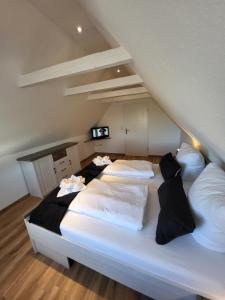 Postel nebo postele na pokoji v ubytování FeWo-Butze 4 mit Balkon