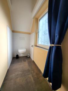Koupelna v ubytování FeWo-Butze 4 mit Balkon